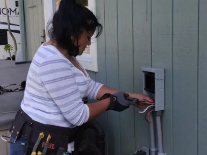 Licensed electrician wiring an exterior subpanel in Litchfield